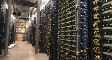 Rows of ASIC miners installed in a mining facility